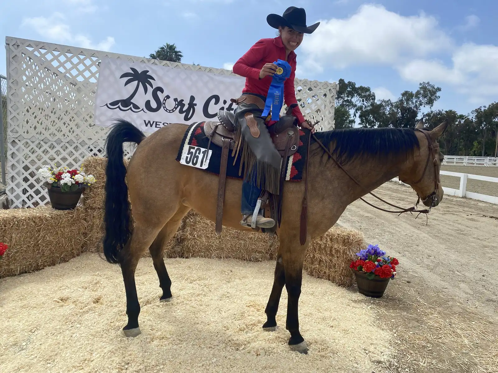 Youth rider celebrating blue ribbon win